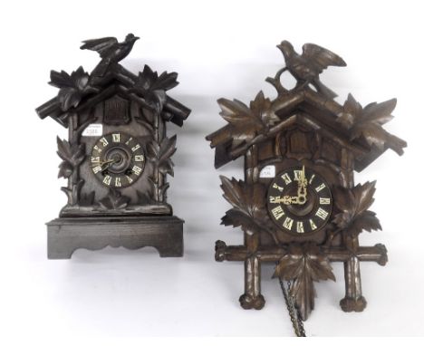 Black Forest cuckoo table clock striking on a gong, within a chalet case, 15.25" high; also a Black Forest cuckoo wall clock,