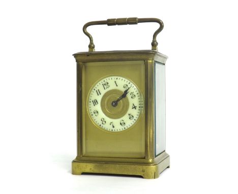French carriage clock striking on a gong, the 2.5" cream chapter ring within a gilt mask and corniche brass case, 7" high (ke