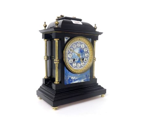 French ebonised and porcelain mounted two train mantel clock, the Japy Freres movement striking on a bell, the 3.5" painted p