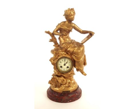 French gilt metal and red marble two train figural mantel clock striking on a bell,  20.5" high (pendulum)
