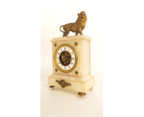 White onyx mantel clock timepiece, with skeletonised dial and surmounted by a lion, 13" high