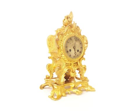 French gilt metal two train mantel clock striking on a bell, within a rococo style ornate case, 11" high (key)