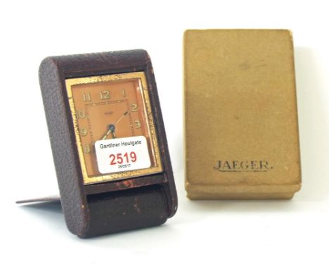 Jaeger-LeCoultre travel alarm clock, within a folding maroon leather case, 4.5" wide overall