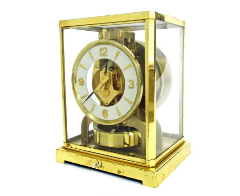 Jaeger-LeCoultre Atmos clock, the 4.25" white dial enclosing a skeletonised centre, within a brass glazed case, no. 194121, 8