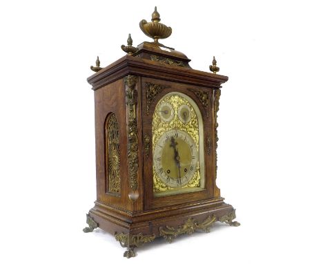 Oak boardroom two train ting-tang mantel clock with W & H movement, the 7.5" brass arched dial with silvered chapter ring enc