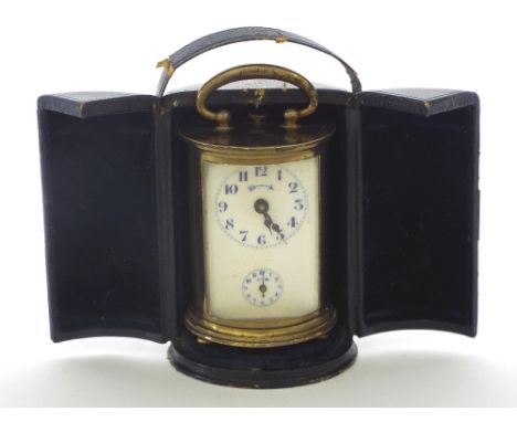 Miniature cylindrical carriage clock timepiece with alarm, 3.75" high; with outer folding Morocco travelling case