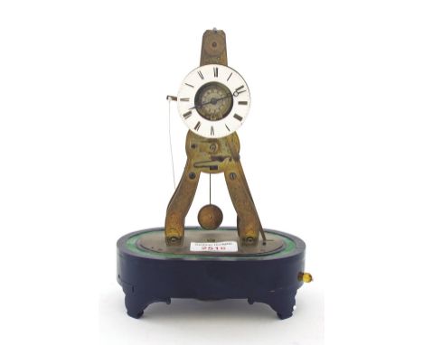 French brass skeleton clock timepiece with passing strike on a bell beneath the base, the 2.25" chapter ring enclosing a skel