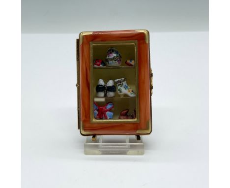 Exquisite Limoges porcelain trinket box crafted in the form of a miniature cabinet, complete with tiny hand-painted shoes, a 