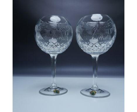 A pair of exquisite Waterford Crystal toasting goblets from The Millennium Collection. These goblets, crafted from the finest