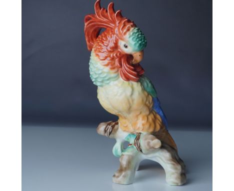 This exquisite Herend Hungary hand-painted porcelain cockatoo figurine captures the elegance and vibrancy of this exotic bird