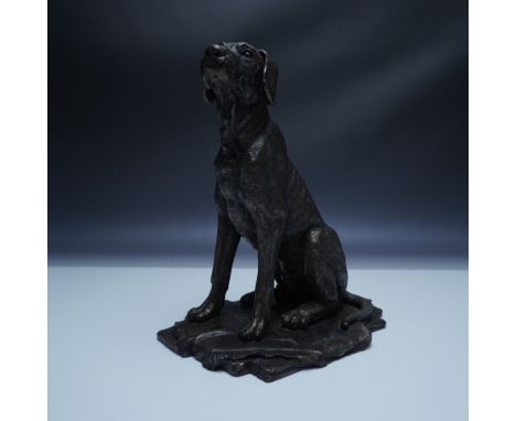 Finely crafted bronze sculpture depicting a Labrador Retriever in a seated position, showcasing remarkable lifelike detail. T