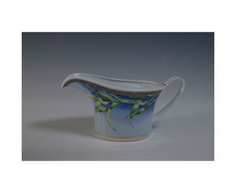 Rosenthal Versace Jungle porcelain gravy boat. This elegant piece features a vibrant botanical design on a blue gradient back