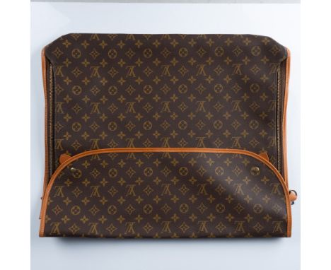 A vintage Louis Vuitton garment cover crafted from the brands iconic monogram canvas. This stylish and functional piece featu