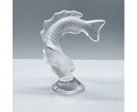 A frosted glass koi fish leaping down onto a clear crystal base. Etched Lalique France on the side of the base. This item has