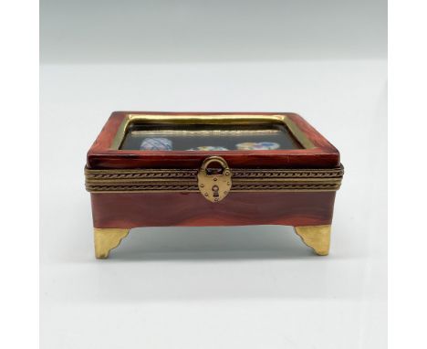 Hand-painted Limoges France Eximious porcelain trinket box designed as a small decorative chest with an ornate brass clasp an
