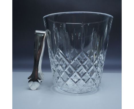 This stunning Waterford crystal ice bucket showcases the elegant Killarney pattern, featuring intricate diamond cuts that shi