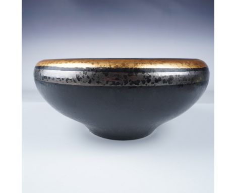 This handcrafted ceramic bowl by Nazareno Picchiotti Deruta features a rich black glaze accented with a striking gold and sil