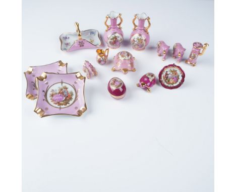 A charming 14-piece collection of porcelain miniatures made in Limoges, France. This delightful assortment features two shade