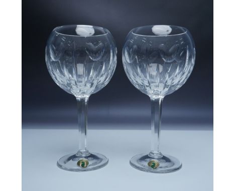 A pair of exquisite Waterford Crystal toasting goblets from The Millennium Collection. These goblets, crafted from the finest