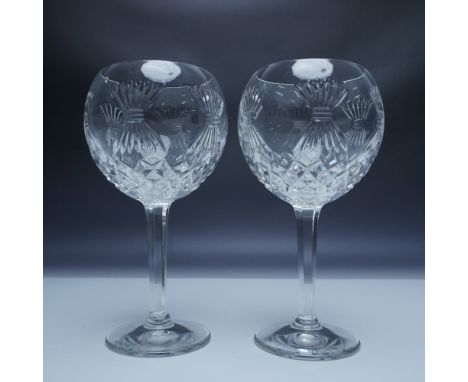 A pair of exquisite Waterford Crystal toasting goblets from The Millennium Collection. These goblets, crafted from the finest
