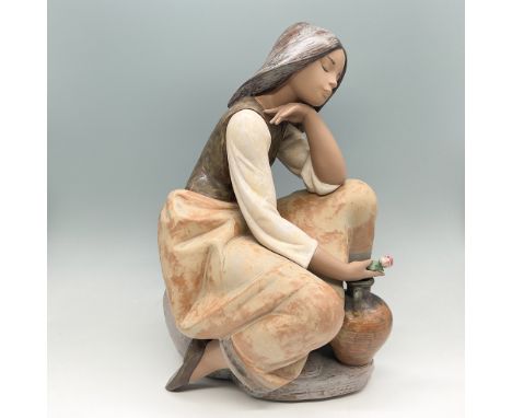Lladro porcelain figurine titled Classic Water Carrier, model number 01013525, depicting a young woman in a contemplative pos