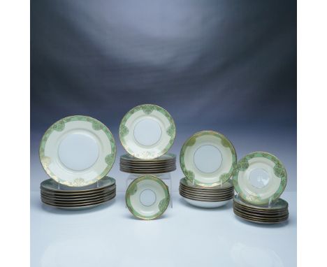 Elegant Hutschenreuther Bavaria porcelain dinnerware set featuring a refined design with a green and gilt floral pattern on a