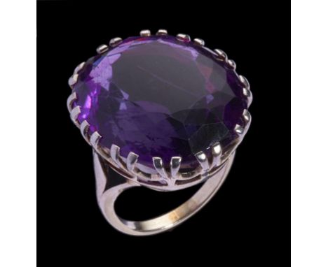 AN AMETHYST RING the oval amethyst 22 x 20mm, in white metal, unmarked, 12.4g, size K++Good condition