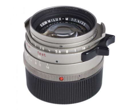 A LEICA M6 TITANIUM AND BLACK LEATHER BODIED CAMERA, NO 2002530, 1994  boxed almost mint, Leitz Summilux  M 1:1.4/35mm titani
