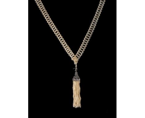 A PEARL AND DIAMOND SAUTOIR, EARLY 20TH C the tassel in white gold, 60cm, unmarked, 39.5g++Good condition