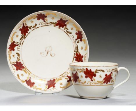 A PINXTON INITIALLED TEA CUP AND SAUCER, 1796-1813  pattern 312, en suite with the two preceding lots, but with the gilt init
