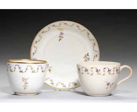 A PINXTON BUTE SHAPED TEA BOWL AND SAUCER, 1796-1813   pattern 44, enamelled in blue and green with pink accents and gilt wit