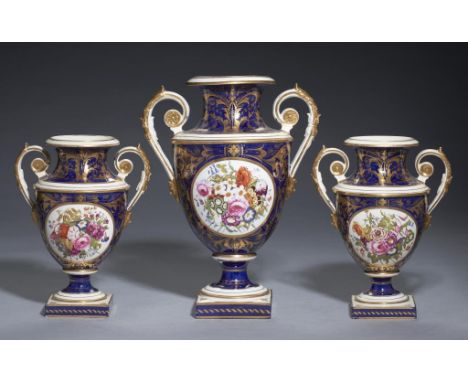 A DERBY GARNITURE OF THREE VASES, C1820 painted with a central round panel of flowers, 30cm h,  crown and D mark++Large vase 