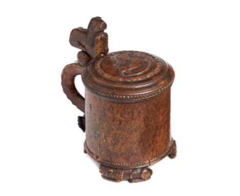 A NORWEGIAN CARVED BURR BIRCH PEG TANKARD, 18TH C  the lid with carved royal lion roundel, 18cm h excluding finial++One foot 
