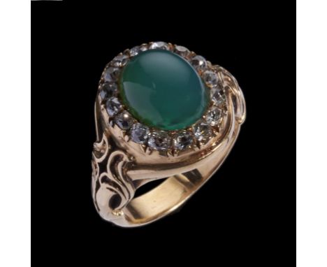 A GREEN STONE AND DIAMOND CLUSTER RING closed back setting, in gold, unmarked, 13.4g, size M++Good condition