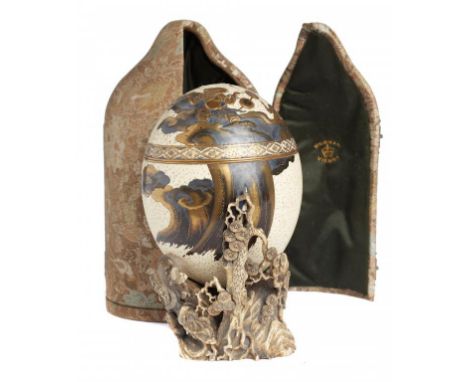 A JAPANESE LACQUERED OSTRICH EGG OBJET DE FANTAISIE, MEIJI PERIOD  decorated with Fujin and Raijin, in  hiramakie, takamakie 