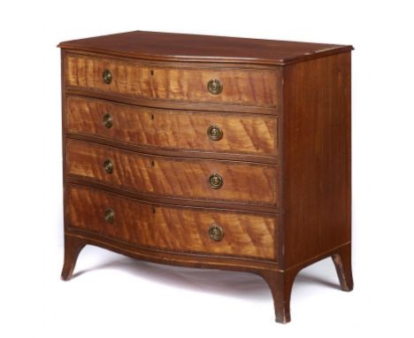 A  VICTORIAN SERPENTINE SATINWOOD, MAHOGANY AND ROSEWOOD COMMODE, C1880  the top with figured mahogany oval, fitted four grad