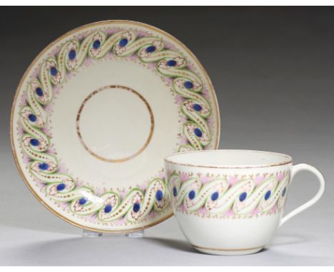 A PINXTON TEACUP AND SAUCER,   1796-1813  pattern 332, with blue, green and pink enamel peacock feather border, saucer 14.5cm