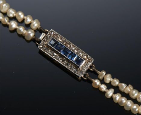 A NATURAL PEARL NECKLACE WITH SAPPHIRE AND DIAMOND CLASP baroque pearls of approx 2mm each, 38cm, 10.3g++Good condition - Som