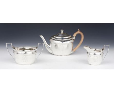 A GEORGE III   OVAL SILVER TEA SERVICE  the domed lid with integral hinge, teapot 15.5cm h, by John Emes, London 1800, the ju