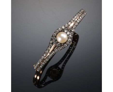 A FRENCH PEARL AND DIAMOND BANGLE, C 1890 in gold, 56 x 46 mm, unmarked, 10.2g, morocco case signed for Russell Goldsmith Mal