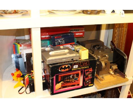 Guitar, various toys, Kodascope Eight-500 projector, etc
