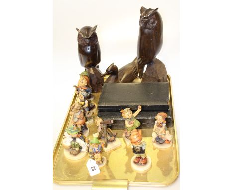 Three carved wood animals, two boxes of cutlery and ten Hummel figures