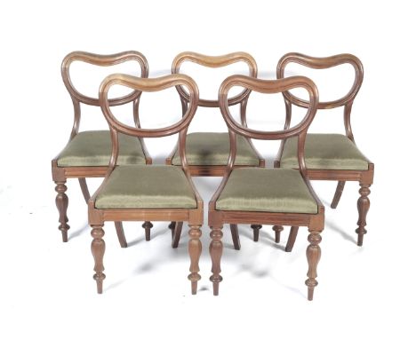 A set of five 19th century mahogany dining chairs. With balloon/bow backs, drop in seats with green watered silk coverings an