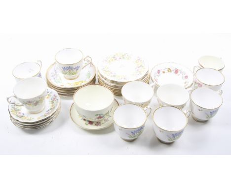 A collection of assorted 20th century floral tea cups and saucers. Including Royal Worcester Sandringham, Royal Doulton Rosel
