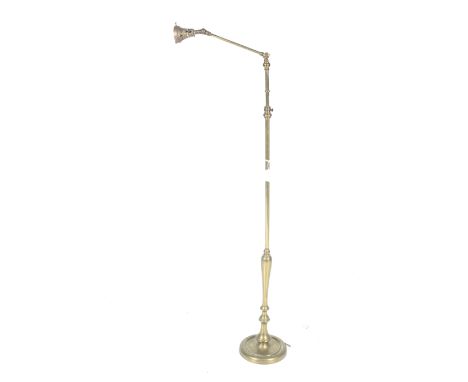 An early 20th century brass floor standing articulated standard floor lamp. Of adjustable height, etc. Circa H130cm