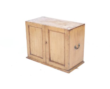 A 20th century PINE collectors chest and contents. Two doors opening to reveal seven graduated drawers with fitted linings. W