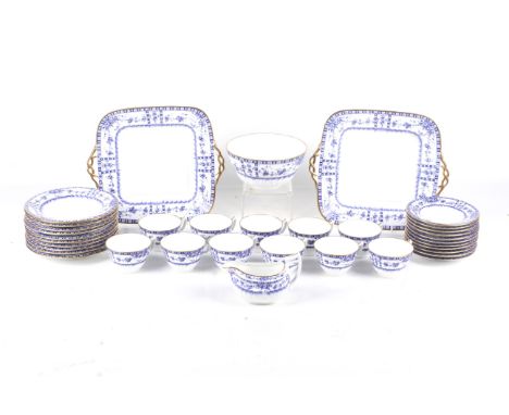 A Wedgwood tea service. With blue and white borders of flowers within gilt rims. Comprising 11 cups and saucers, ten side pla