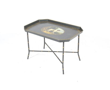 A 20th century Regency style painted tin tray on stand. Of rectangular form, with image of a hunting dog and gilt decoration 