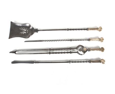 A set of four Georgian steel and brass fire irons. Comprising a poker, tongs, shovel and a shorter poker, with barley twist d