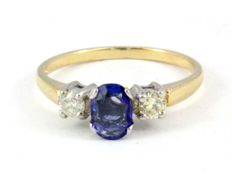 A 9ct yellow gold oval cut sapphire and diamond set ring, (O.5).